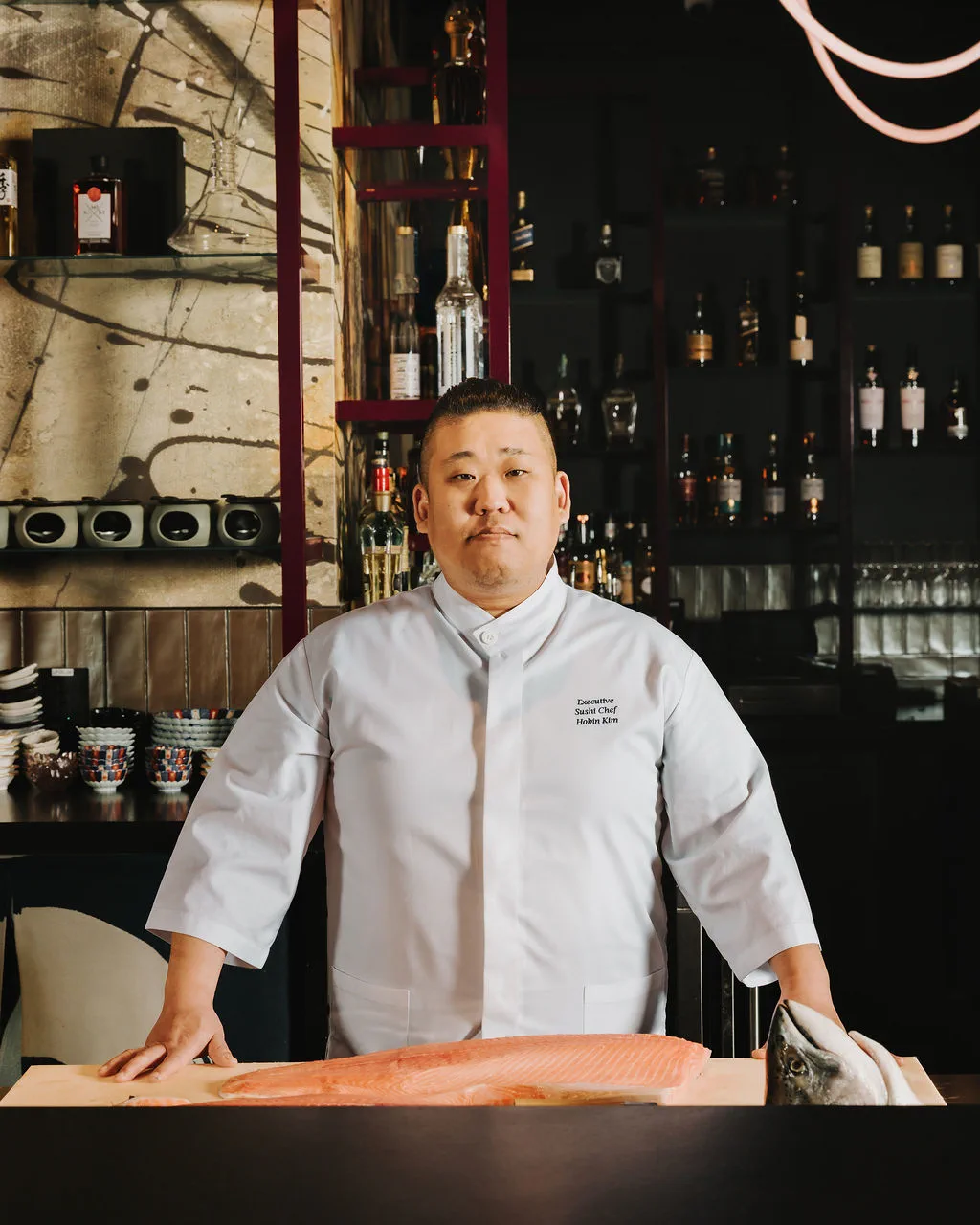 Executive Sushi Chef James Kim with a whole salmon at The Naisho Room